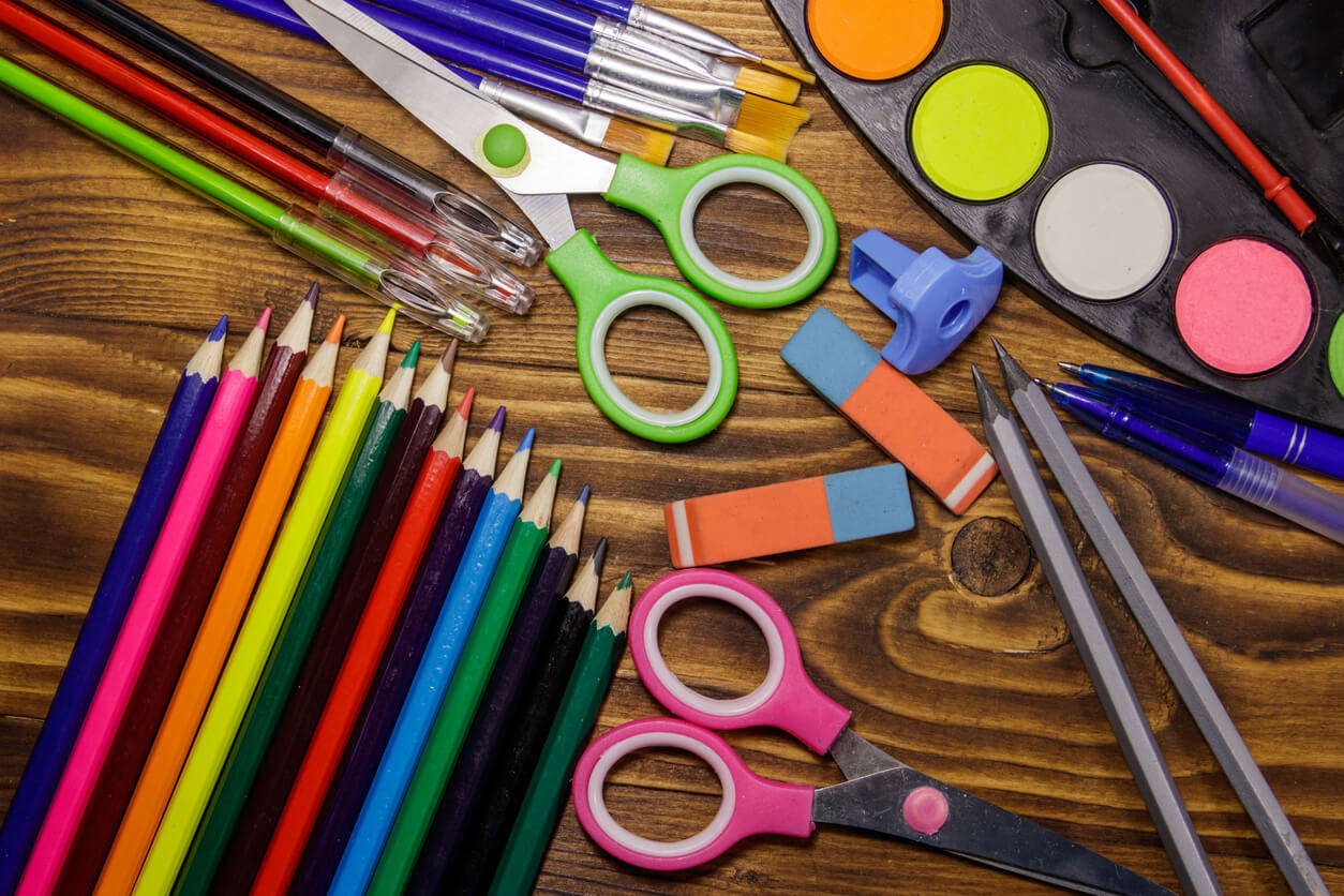 A variet of colourful stationery items 