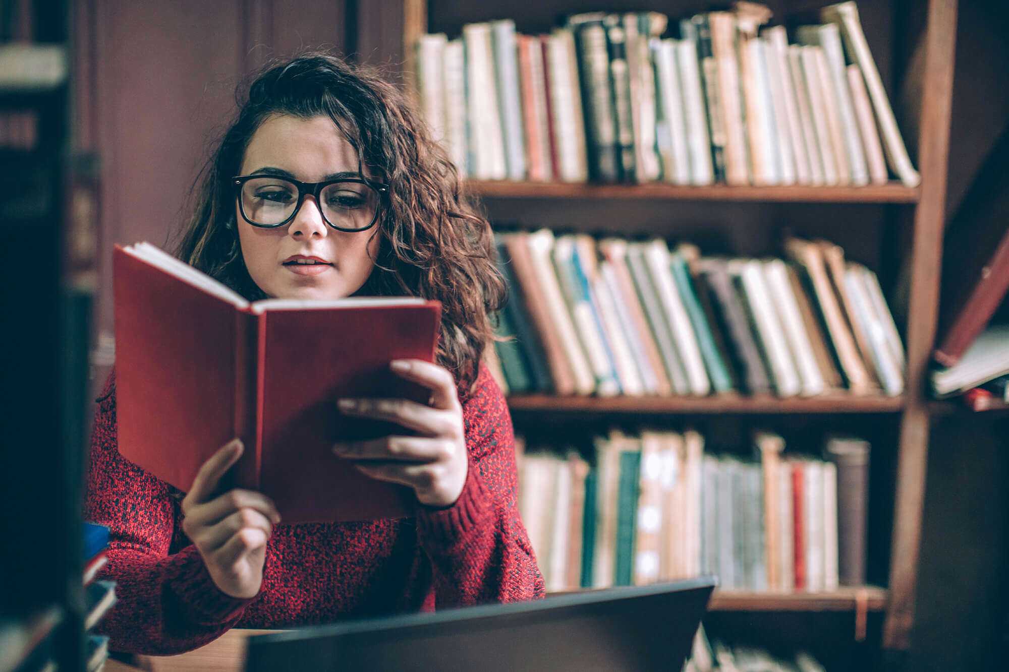 A young woman reading a book 