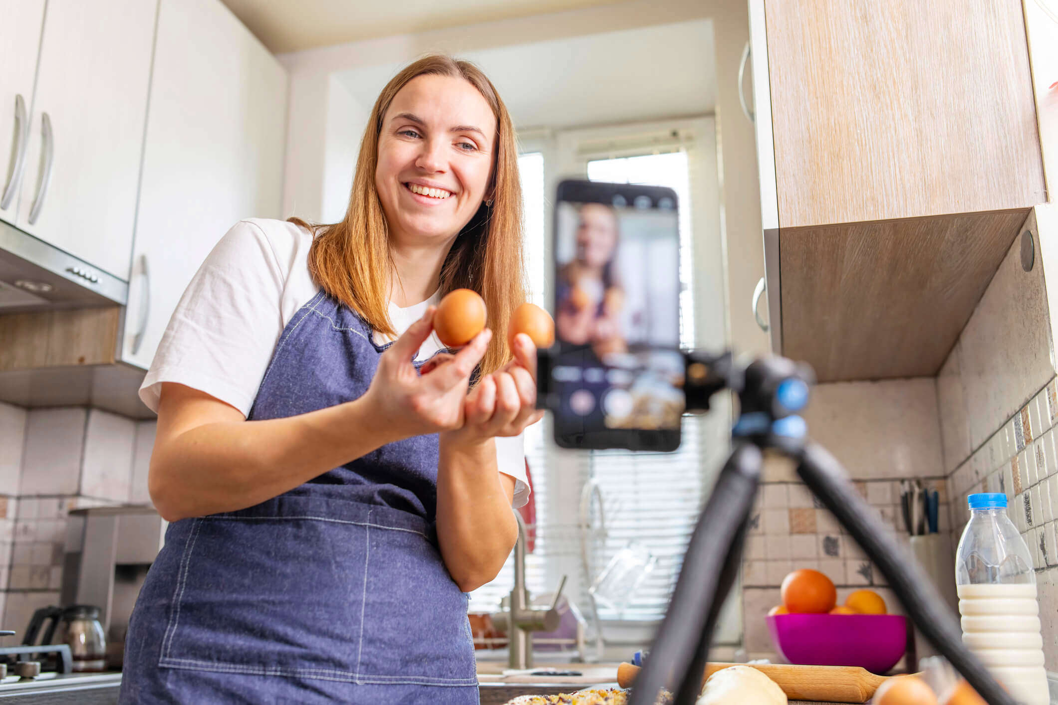 A woman recording a live cooking session for the Virtual Village Hall